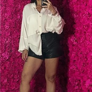 Chic White Blouse and Black Vegan Leather Shorts